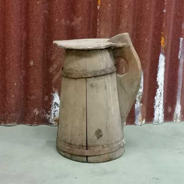 Large antique wooden pitcher with heather lid
